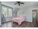 Cozy bedroom with wood floors, bright windows, and simple decor at 105 Bobcat Ln, Ravenel, SC 29470