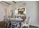 Charming dining room with a crystal chandelier and seating for six at 105 Bobcat Ln, Ravenel, SC 29470