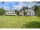 Spacious property featuring a lush green lawn and two charming homes with welcoming facades at 105 Bobcat Ln, Ravenel, SC 29470