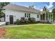 Well-maintained home with a manicured lawn, showcasing its charming facade and curb appeal at 105 Bobcat Ln, Ravenel, SC 29470