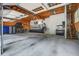 Well-lit garage with exposed wooden beams, a concrete floor, and ample storage space at 105 Bobcat Ln, Ravenel, SC 29470