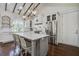 Well-lit kitchen features a large island, stainless steel appliances, and ample cabinet space at 105 Bobcat Ln, Ravenel, SC 29470