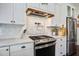 Stylish kitchen with stainless steel appliances, granite countertops, and white cabinets at 105 Bobcat Ln, Ravenel, SC 29470