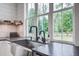 Kitchen sink with stainless steel faucet and a view to the outdoors at 105 Bobcat Ln, Ravenel, SC 29470