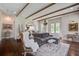 Cozy living room with hardwood floors, exposed beams, and an inviting seating arrangement at 105 Bobcat Ln, Ravenel, SC 29470