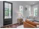 Comfortable living room boasts shiplap walls, stylish furniture, and natural light at 105 Bobcat Ln, Ravenel, SC 29470