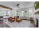 Spacious living room with an open layout to kitchen, fireplace, and hardwood flooring at 105 Bobcat Ln, Ravenel, SC 29470