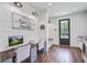 Versatile office or bonus space with a built-in desk, wood floors, and a view to the backyard at 105 Bobcat Ln, Ravenel, SC 29470