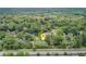 An aerial view shows the neighborhood nestled among mature green trees and greenery at 109 Fort St, Summerville, SC 29485