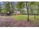 Large backyard with trees, green grass, and recreational equipment at 109 Fort St, Summerville, SC 29485