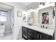 Elegant bathroom with double vanity, modern fixtures, and stylish mirrors, creating a luxurious and functional space at 109 Fort St, Summerville, SC 29485