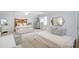 Large bedroom with a queen size bed, daybed, and macrame swing creates a spacious retreat at 109 Fort St, Summerville, SC 29485