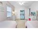 Bright bedroom with dual beds, pink walls, and stylish decor create a welcoming atmosphere at 109 Fort St, Summerville, SC 29485