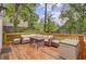 Inviting backyard deck with wood railings and wicker furniture, perfect for outdoor entertaining at 109 Fort St, Summerville, SC 29485