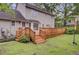 Back exterior view of home with a large wooden deck and access to the backyard at 109 Fort St, Summerville, SC 29485