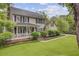 Inviting two-story home with a welcoming front porch, American flag, and lush landscaping at 109 Fort St, Summerville, SC 29485