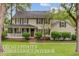 Charming two-story home with a well-maintained lawn and a welcoming front porch at 109 Fort St, Summerville, SC 29485