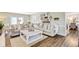 Spacious living room featuring hardwood floors, lots of comfortable seating, and bright natural light at 109 Fort St, Summerville, SC 29485