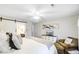 Spacious main bedroom with a view to the ensuite bath, comfortable seating, and stylish decor, and ample lighting at 109 Fort St, Summerville, SC 29485