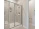 Modern bathroom with a glass-enclosed shower featuring tile walls and flooring at 109 Indigo Cove Blvd, Summerville, SC 29486