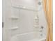 Shower stall featuring a new shower head, a curtain, and built-in shelving at 109 Indigo Cove Blvd, Summerville, SC 29486