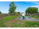 Expansive backyard featuring a fire pit area and a storage shed, offering both relaxation and practicality at 1103 Cates Ct, Summerville, SC 29483