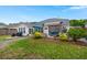 Open backyard featuring covered patio with outdoor seating, manicured lawn, and landscaping at 1103 Cates Ct, Summerville, SC 29483
