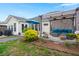 Inviting backyard featuring a covered patio area with outdoor seating, lush landscaping, and manicured lawn at 1103 Cates Ct, Summerville, SC 29483