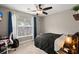 Bedroom with large window, ceiling fan, and desk in a well-lit space at 1103 Cates Ct, Summerville, SC 29483
