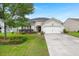 Charming single-story home featuring a well-manicured lawn, inviting curb appeal, and an attached two-car garage at 1103 Cates Ct, Summerville, SC 29483