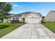 Charming single-story home featuring a well-manicured lawn, inviting curb appeal, and an attached two-car garage at 1103 Cates Ct, Summerville, SC 29483