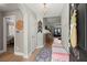 Open foyer with wood floors, stylish lighting, and inviting decor that leads into the main living spaces at 1103 Cates Ct, Summerville, SC 29483