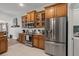 Kitchen with sleek stainless steel fridge and microwave set within beautiful wood cabinetry for ample storage space at 1103 Cates Ct, Summerville, SC 29483