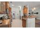 Well-equipped kitchen featuring wood cabinets, stainless steel appliances, and seamless transition to dining area at 1103 Cates Ct, Summerville, SC 29483