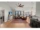 Spacious living room with hardwood floors, comfortable seating, and views of the dining and kitchen areas at 1103 Cates Ct, Summerville, SC 29483