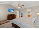 Spacious main bedroom with a TV, dresser, large windows, and access to the main bathroom at 1103 Cates Ct, Summerville, SC 29483