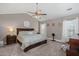 Tranquil main bedroom featuring a vaulted ceiling, ceiling fan, and a king bed with a decorative comforter at 1103 Cates Ct, Summerville, SC 29483