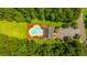Overhead view of a community pool and clubhouse surrounded by lush green trees and lawn at 112 Lake Jogassee Dr, Summerville, SC 29485