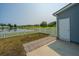 Fenced backyard offers a tranquil view of the pond and landscaping at 112 Lake Jogassee Dr, Summerville, SC 29485