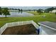Backyard view from the home of a grassy yard and a pond at 112 Lake Jogassee Dr, Summerville, SC 29485