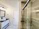 Modern bathroom with glass shower and vanity with black countertop at 112 Lake Jogassee Dr, Summerville, SC 29485