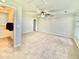 Upstairs bedroom includes a ceiling fan, neutral carpet and wall colors, and attic access at 112 Lake Jogassee Dr, Summerville, SC 29485