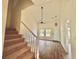 Spacious living room with high ceiling, staircase, and wood flooring at 112 Lake Jogassee Dr, Summerville, SC 29485