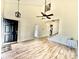 Bright living room boasts vaulted ceilings, wood floors, and stylish light fixtures at 112 Lake Jogassee Dr, Summerville, SC 29485