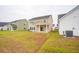 The backyard is grassy with adjacent homes nearby at 112 Moscato Ln, Summerville, SC 29485