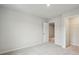 This airy bedroom offers an open doorway to the closet and neutral carpet, paint, and trim throughout at 112 Moscato Ln, Summerville, SC 29485