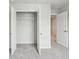 A neutral-toned bedroom closet featuring open doors, wire shelving, and plush carpeting for storage at 112 Moscato Ln, Summerville, SC 29485