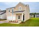 Inviting two-story house featuring neutral siding, tidy front lawn, and a convenient attached one-car garage at 112 Moscato Ln, Summerville, SC 29485