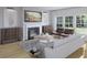 Cozy living room with a fireplace, comfortable seating, and ample natural light at 112 Moscato Ln, Summerville, SC 29485