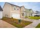 Street view of newly constructed houses in a suburban neighborhood with fresh landscaping at 112 Moscato Ln, Summerville, SC 29485